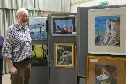 Leader Brian reviews his group's paintings